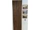 Attractive wall decor with wood paneling and three framed mountain landscape pictures at 7492 Country Brook Dr, Indianapolis, IN 46260
