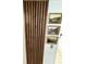 Interesting wall decor, featuring wood slats and three nature-themed paintings at 7492 Country Brook Dr, Indianapolis, IN 46260