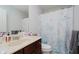 Well-lit bathroom featuring a vanity, mirror, toilet, and themed shower curtain at 755 Ivy Ln, Carmel, IN 46032