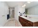 Bathroom includes dual sinks, a vanity, and a separate shower at 755 Ivy Ln, Carmel, IN 46032