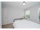 Bright bedroom with neutral colors, natural light, and simple furnishings at 755 Ivy Ln, Carmel, IN 46032