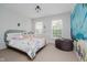 Charming bedroom featuring a unique ocean mural, comfortable furniture, and bright light at 755 Ivy Ln, Carmel, IN 46032