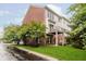 Brick and siding condo building with well maintained lawn and mature landscaping at 755 Ivy Ln, Carmel, IN 46032