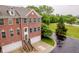 Beautiful brick townhouse featuring a private garage and a charming entryway with wrought iron railings at 755 Ivy Ln, Carmel, IN 46032