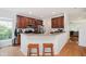 Kitchen with granite countertops, dark wood cabinets, and stainless steel appliances at 755 Ivy Ln, Carmel, IN 46032
