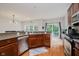 Kitchen featuring granite countertops, stainless steel appliances, and a view to dining at 755 Ivy Ln, Carmel, IN 46032