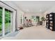 Spacious living room with large windows, access to the yard, and ample natural light at 755 Ivy Ln, Carmel, IN 46032