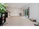 Open living room with walkout to backyard, neutral colors and plenty of space for entertaining at 755 Ivy Ln, Carmel, IN 46032