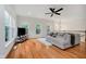 Open living room with hardwood floors, large windows, and comfortable seating at 755 Ivy Ln, Carmel, IN 46032
