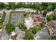 Aerial view of tennis court, pool, clubhouse, and pond at 8133 Lower Bay Ln, Indianapolis, IN 46236