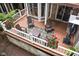 Outdoor deck with seating, fire pit, and tranquil natural surroundings at 8133 Lower Bay Ln, Indianapolis, IN 46236