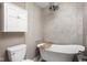 Stylish bathroom with a standalone tub and tiled walls, creating a luxurious and relaxing atmosphere at 8133 Lower Bay Ln, Indianapolis, IN 46236