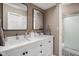 Elegant bathroom featuring double sinks, modern fixtures, and a separate shower for a spa-like experience at 8133 Lower Bay Ln, Indianapolis, IN 46236