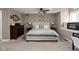 Comfortable bedroom with neutral tones, a ceiling fan and carpeted floors; perfect for relaxation and rest at 8133 Lower Bay Ln, Indianapolis, IN 46236
