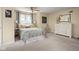 Bright bedroom with a cozy bed, dresser, and natural light, creating a comfortable and inviting space at 8133 Lower Bay Ln, Indianapolis, IN 46236