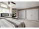 Spacious bedroom featuring a fireplace, work area, and ample closet space for optimal comfort and organization at 8133 Lower Bay Ln, Indianapolis, IN 46236