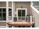 A cozy outdoor balcony featuring a grill and outdoor seating offers an intimate space at 8133 Lower Bay Ln, Indianapolis, IN 46236