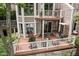 An outdoor deck featuring a seating area and grill provides an outdoor living and dining experience at 8133 Lower Bay Ln, Indianapolis, IN 46236