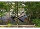 Scenic shot from deck showing a private boat dock, providing easy access to water activities and enjoyment at 8133 Lower Bay Ln, Indianapolis, IN 46236