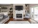 A welcoming living room with a fireplace, creating a cozy atmosphere and an ideal spot for relaxation at 8133 Lower Bay Ln, Indianapolis, IN 46236