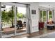 Living room with natural light, lake views, and access to deck at 8133 Lower Bay Ln, Indianapolis, IN 46236