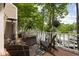 Relaxing patio space with a view of the water featuring comfortable seating and beautiful landscaping at 8133 Lower Bay Ln, Indianapolis, IN 46236
