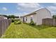 The well-manicured backyard offers a serene retreat with plenty of green space and privacy fencing at 8176 Crumwell Dr, Avon, IN 46123