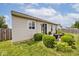 Enjoy the outdoor living space with a patio, lush lawn, and well-maintained shrubs in this charming backyard at 8176 Crumwell Dr, Avon, IN 46123