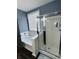 Bright bathroom showcasing a bathtub and shower with sliding glass doors at 8176 Crumwell Dr, Avon, IN 46123