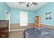 Serene bedroom with blue walls, carpet flooring, and a large window for natural light at 8176 Crumwell Dr, Avon, IN 46123