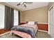 Cozy bedroom featuring a bed, dark curtains, and a ceiling fan for added comfort at 8176 Crumwell Dr, Avon, IN 46123