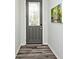 This home's entryway is complete with luxury vinyl flooring and modern door with decorative glass at 8176 Crumwell Dr, Avon, IN 46123