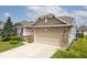Charming single Gathering home features a well-maintained lawn, mature landscaping, and a two-car attached garage at 8176 Crumwell Dr, Avon, IN 46123