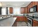 Beautiful kitchen with wood cabinets, stainless appliances, and a stylish breakfast bar at 8176 Crumwell Dr, Avon, IN 46123
