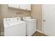 Convenient laundry room with modern washing machine and dryer, plus overhead storage at 8176 Crumwell Dr, Avon, IN 46123