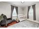 Well-lit Bedroom with hardwood floors, neutral walls, and a white crib at 8436 E 56Th St, Indianapolis, IN 46216