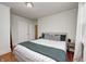 Cozy bedroom with a comfortable bed, neutral decor, and hardwood floors at 8436 E 56Th St, Indianapolis, IN 46216