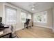 Bright office space with hardwood floors, ample natural light, and comfortable seating at two desks at 8436 E 56Th St, Indianapolis, IN 46216