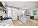 Bright kitchen showcasing a granite countertop island, stainless steel appliances, and a door to the outside at 8436 E 56Th St, Indianapolis, IN 46216
