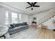 Cozy living room with hardwood floors, a comfortable couch, and a staircase leading to the upper level at 8436 E 56Th St, Indianapolis, IN 46216
