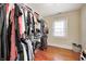 Spacious walk-in closet with built-in shelving and hanging rods providing ample storage at 8436 E 56Th St, Indianapolis, IN 46216