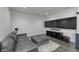 Finished basement with comfortable seating, a mounted TV, and modern entertainment console on a large area rug at 8695 Morgan Dr, Fishers, IN 46038