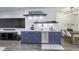 Finished basement featuring a wet bar with undermount stainless sink, dishwasher, and a dining area with a wood table at 8695 Morgan Dr, Fishers, IN 46038