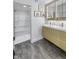 Modern bathroom with a double sink vanity, stylish light fixtures, and an adjacent shower at 8695 Morgan Dr, Fishers, IN 46038