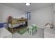 Cozy bedroom with bunk beds, playful decor, and a green table perfect for arts and crafts at 8695 Morgan Dr, Fishers, IN 46038