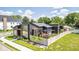 Contemporary home with a beautifully landscaped yard, outdoor seating area, and sleek architectural details at 8695 Morgan Dr, Fishers, IN 46038