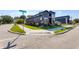Modern black home on a corner lot features professional landscaping and a sidewalk at 8695 Morgan Dr, Fishers, IN 46038