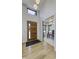 Bright foyer featuring a contemporary wood door and an adjacent office space with modern lighting at 8695 Morgan Dr, Fishers, IN 46038