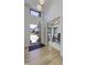 Open foyer with modern wood door, showcasing the bright office space and the view of the neighborhood at 8695 Morgan Dr, Fishers, IN 46038