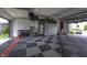 Spacious garage with a checkered floor, LevRack storage system, and ample room for parking and storage at 8695 Morgan Dr, Fishers, IN 46038